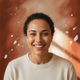 Smiling person in a headshot, conveying trust and happiness.
